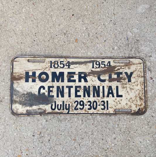 Photo of a 1954 Homer City Pennsylvania Booster License Plate Auto Tag Garage Decor Vintage Metal Centennial with original patina