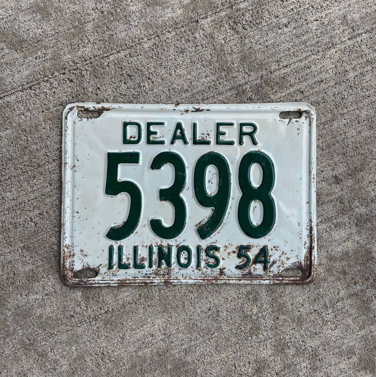 Photo of a 1954 Illinois Dealer License Plate Auto Tag Garage Decor Vintage Low Number Four Digit 5398 with original patina