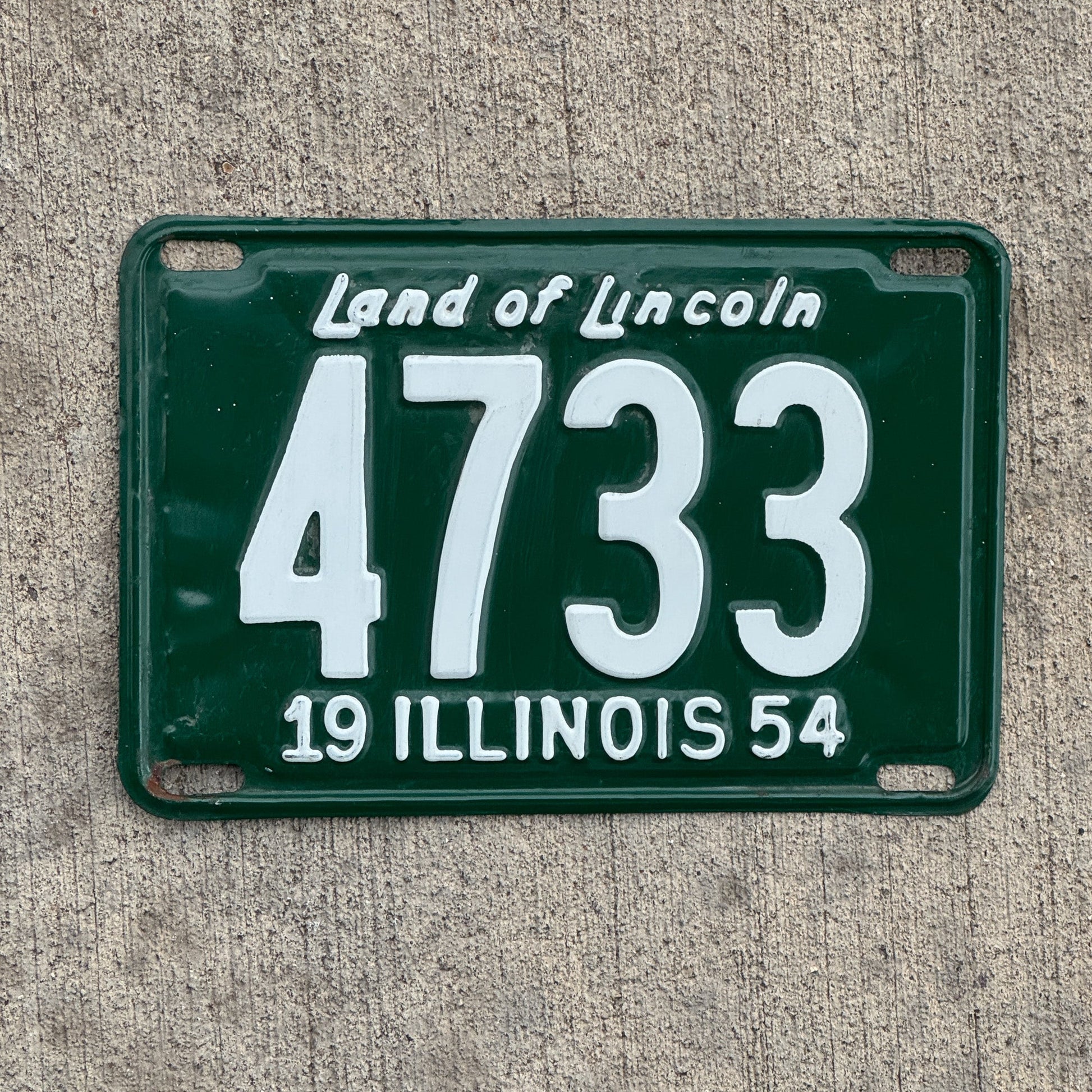 Photo of a 1954 Illinois License Plate Auto Tag Garage Decor Vintage Low Number Four Digit 4733 with original patina
