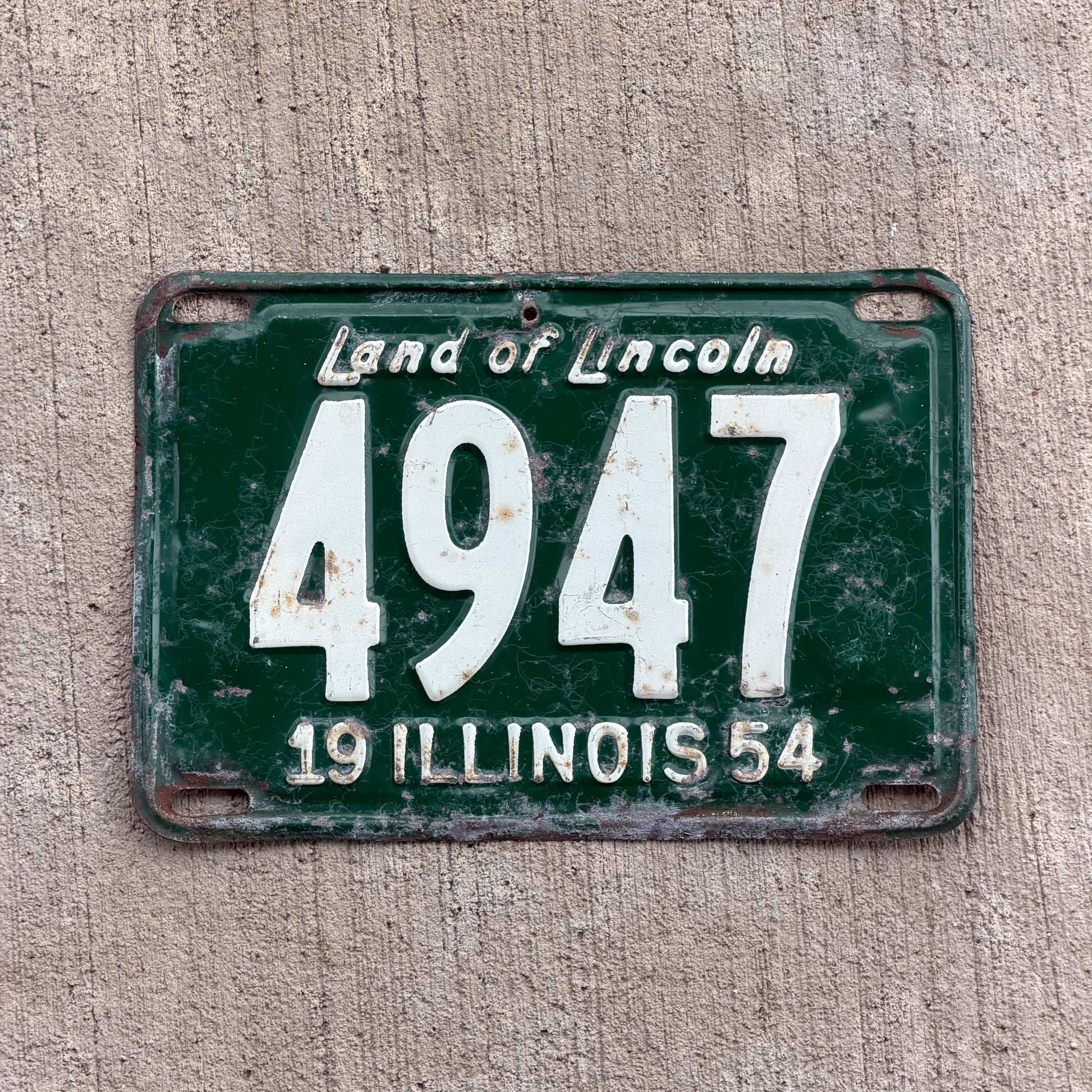 Photo of a 1954 Illinois License Plate Auto Tag Garage Decor Vintage Low Number Four Digit 4947 with original patina