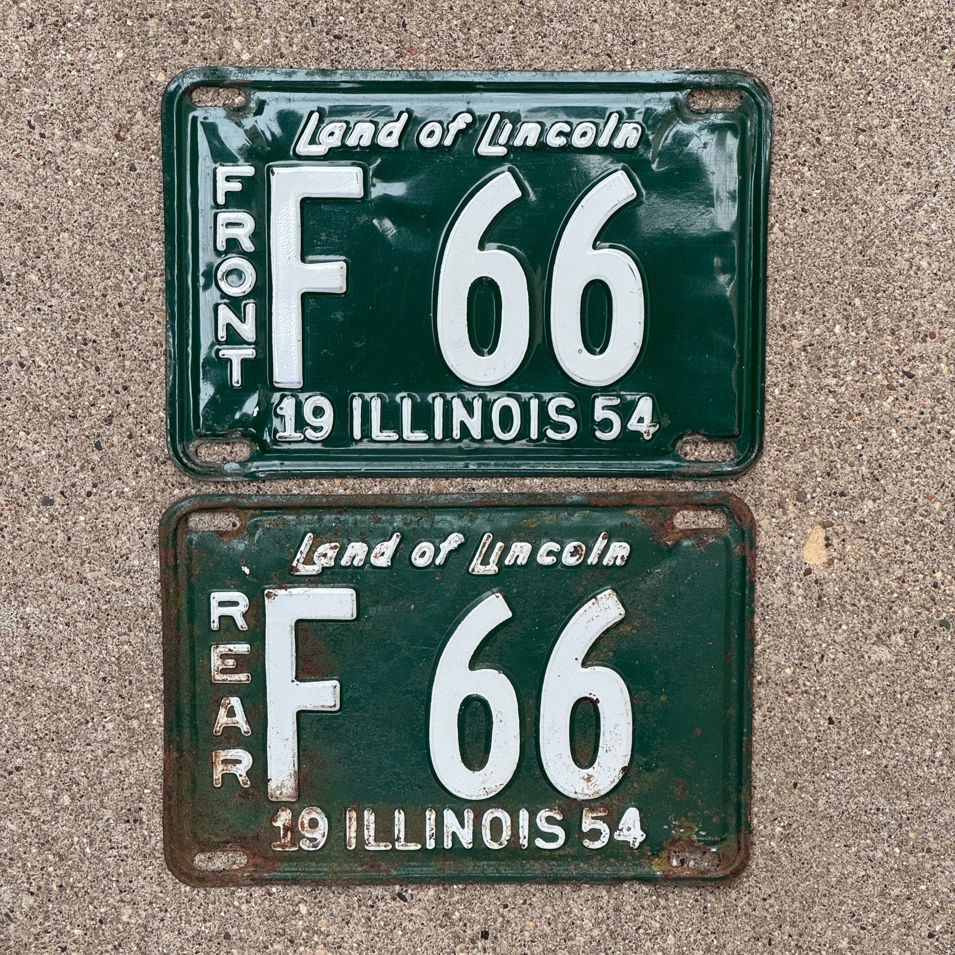 Photo of a 1954 Illinois Truck License Plate Pair Auto Tag Garage Decor Vintage Low Number Two Digit F 66 with original patina