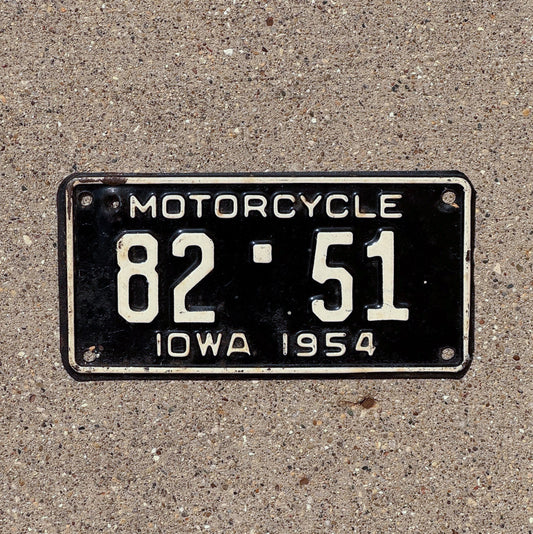 Photo of a 1954 Iowa Motorcycle License Plate Auto Tag Garage Decor Vintage Low Number Two Digit Scott County 82 51 with original patina