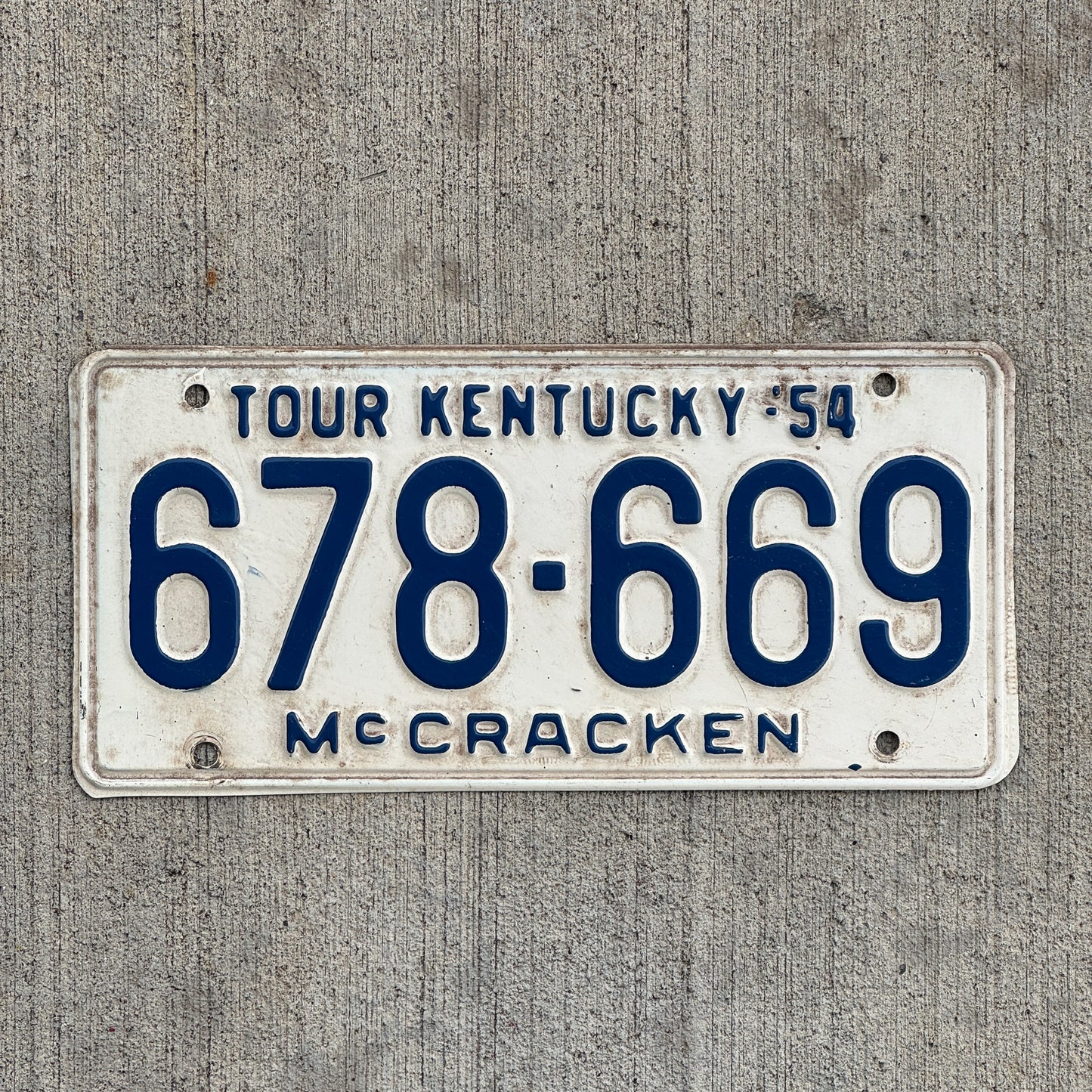 Photo of a 1954 Kentucky License Plate Auto Tag Garage Decor Vintage McCracken County 678 669 with original patina
