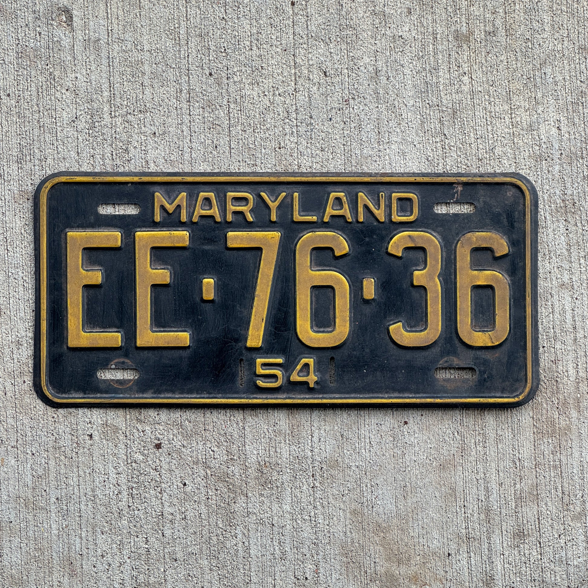 Photo of a 1954 Maryland License Plate Auto Tag Garage Decor Vintage EE 76 36 with original patina