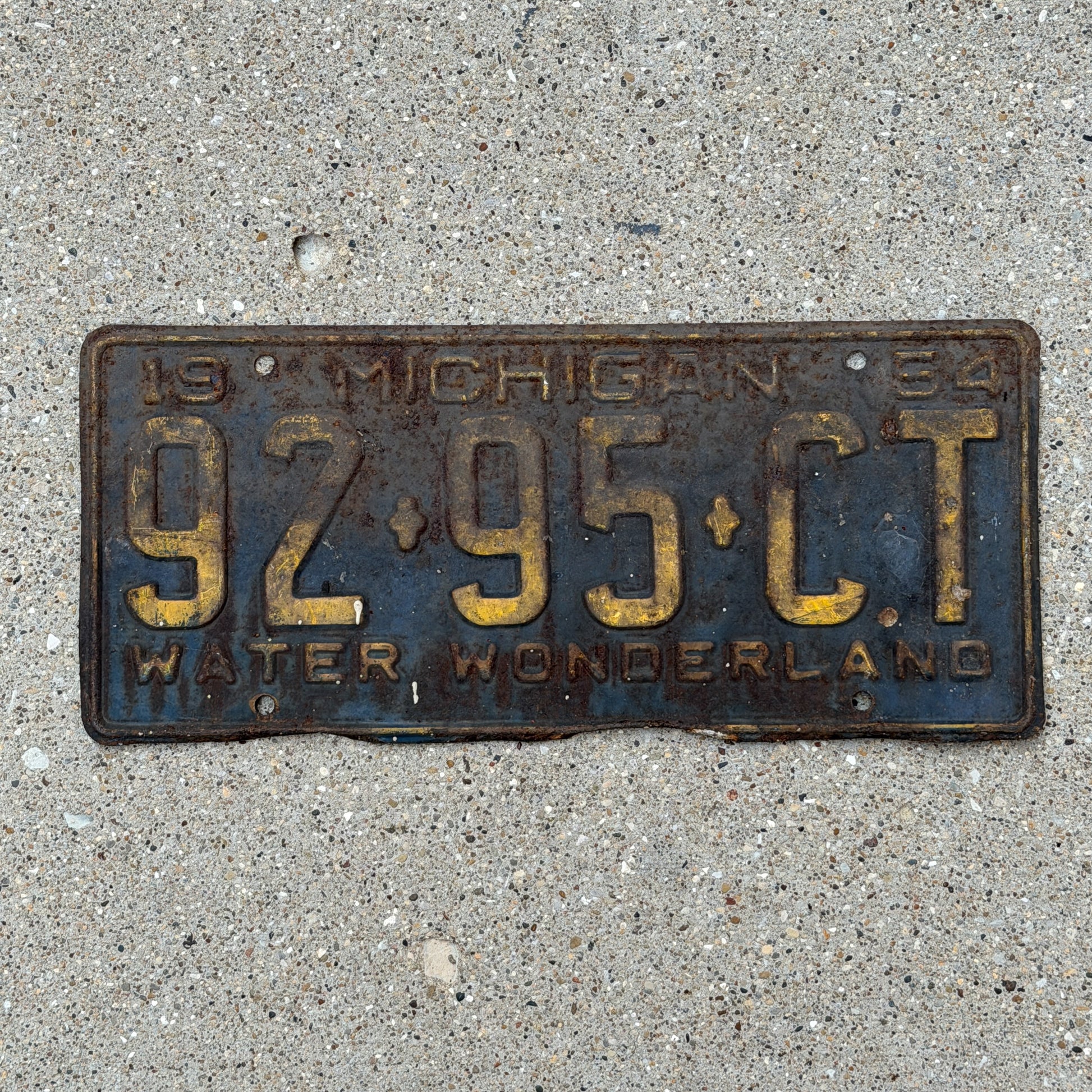 Photo of a 1954 Michigan Commercial License Plate Auto Tag Garage Decor Vintage 92 95 CT with original patina