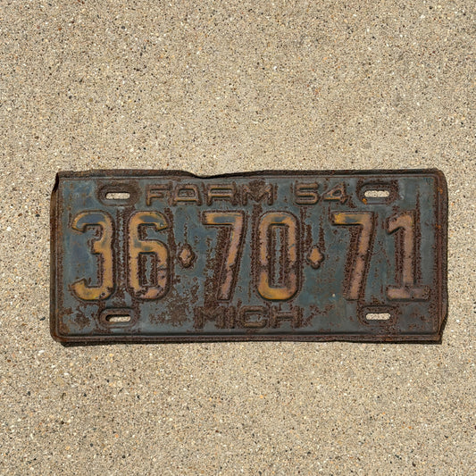 Photo of a 1954 Michigan Farm License Plate Auto Tag Garage Decor Vintage 36 70 71 with original patina