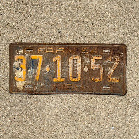 Photo of a 1954 Michigan Farm License Plate Auto Tag Garage Decor Vintage 37 10 52 with original patina