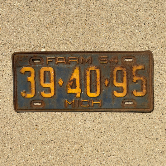 Photo of a 1954 Michigan Farm License Plate Auto Tag Garage Decor Vintage 39 40 95 with original patina