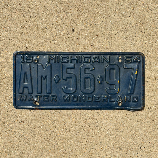 Photo of a 1954 Michigan License Plate Auto Tag Garage Decor Vintage AM 56 97 with original patina