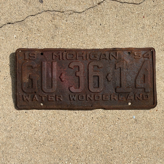 Photo of a 1954 Michigan License Plate Auto Tag Garage Decor Vintage GU 36 14 with original patina