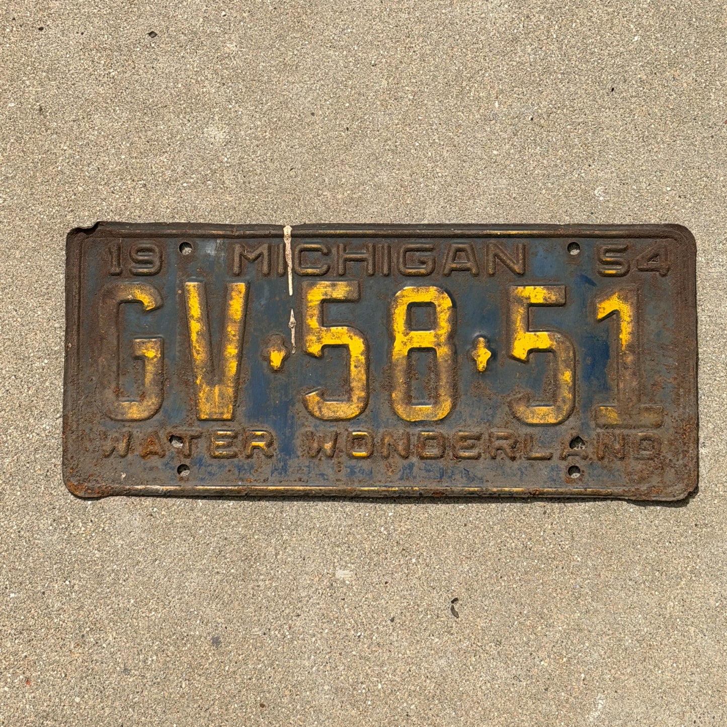 Photo of a 1954 Michigan License Plate Auto Tag Garage Decor Vintage GV 58 51 with original patina