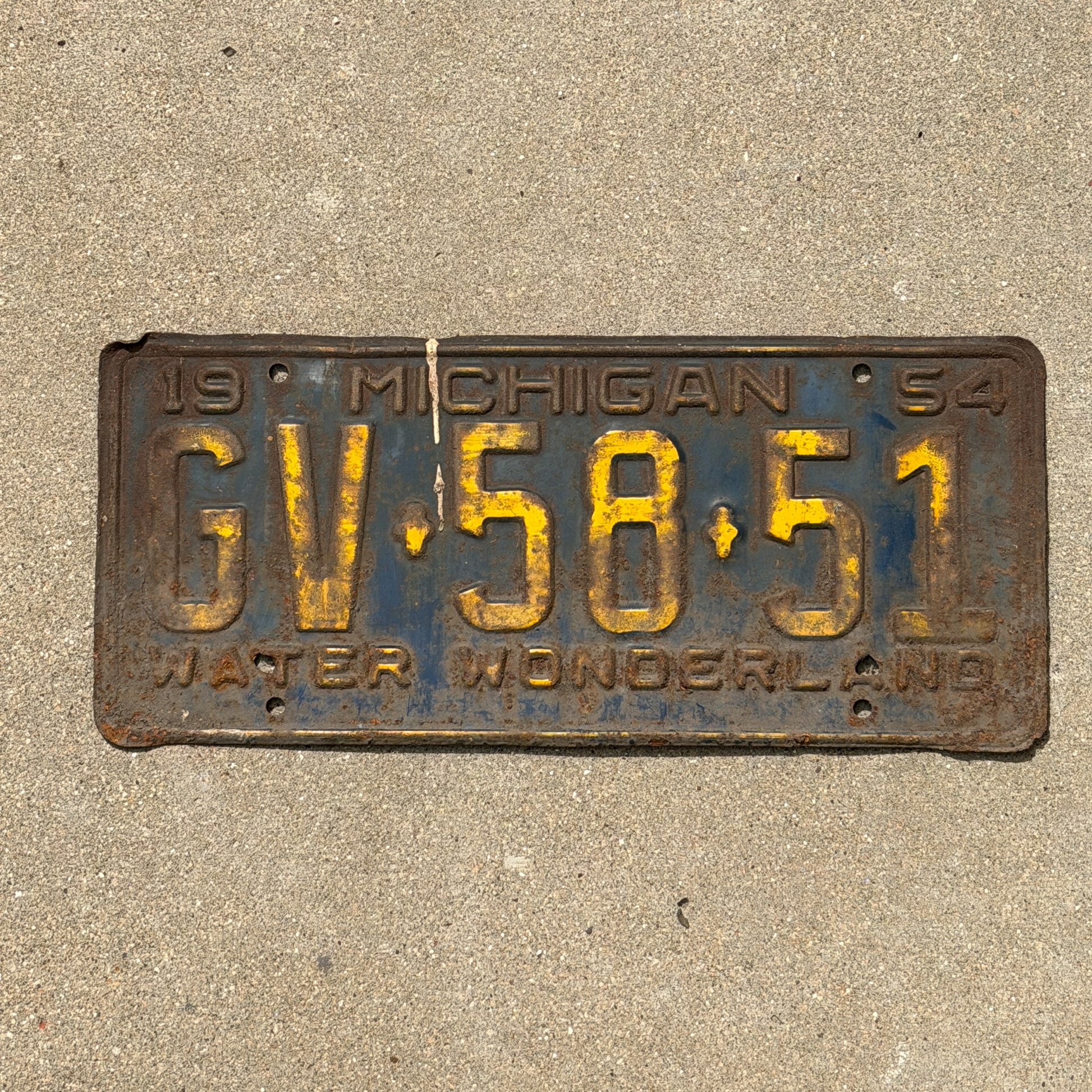Photo of a 1954 Michigan License Plate Auto Tag Garage Decor Vintage GV 58 51 with original patina