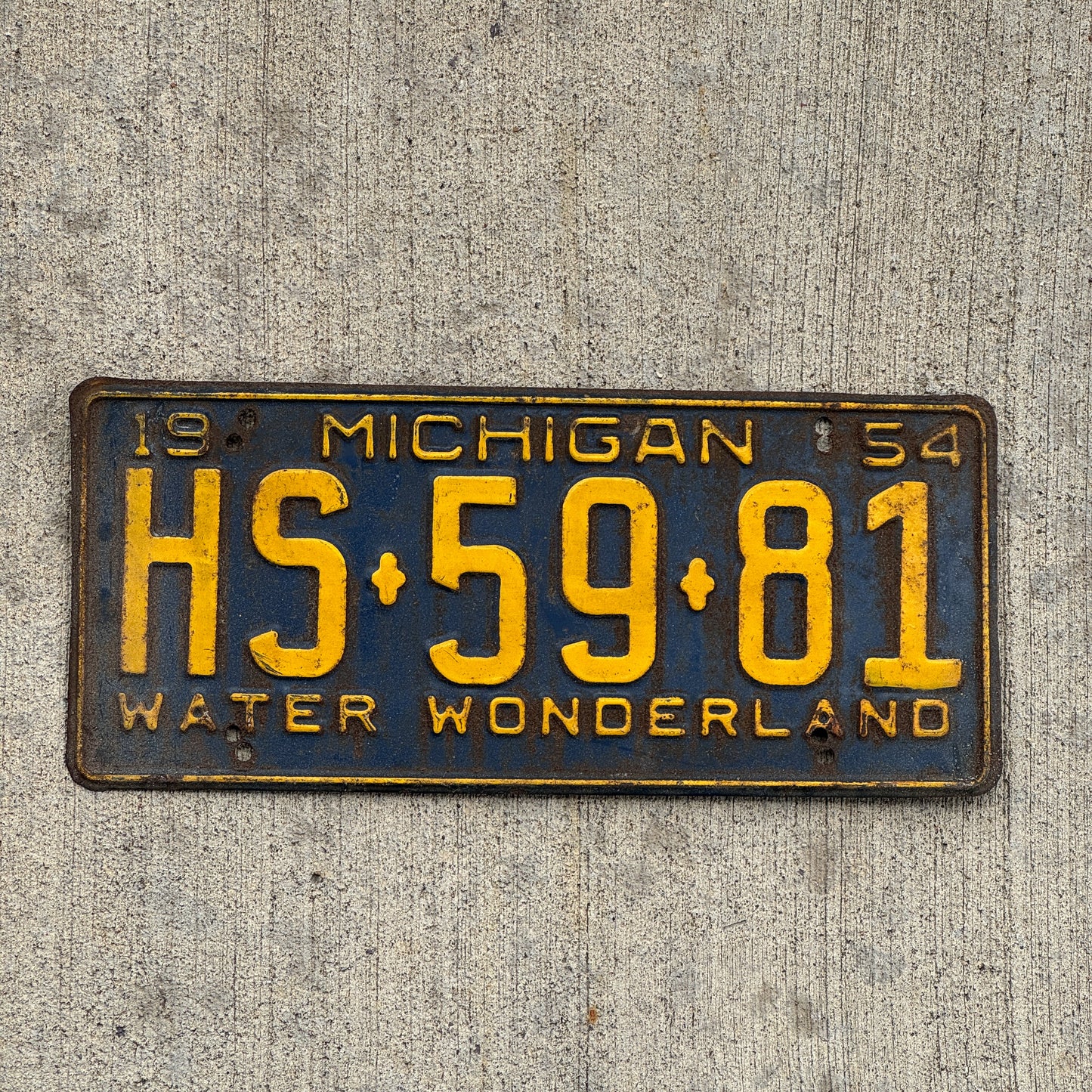 Photo of a 1954 Michigan License Plate Auto Tag Garage Decor Vintage HS 59 81 with original patina