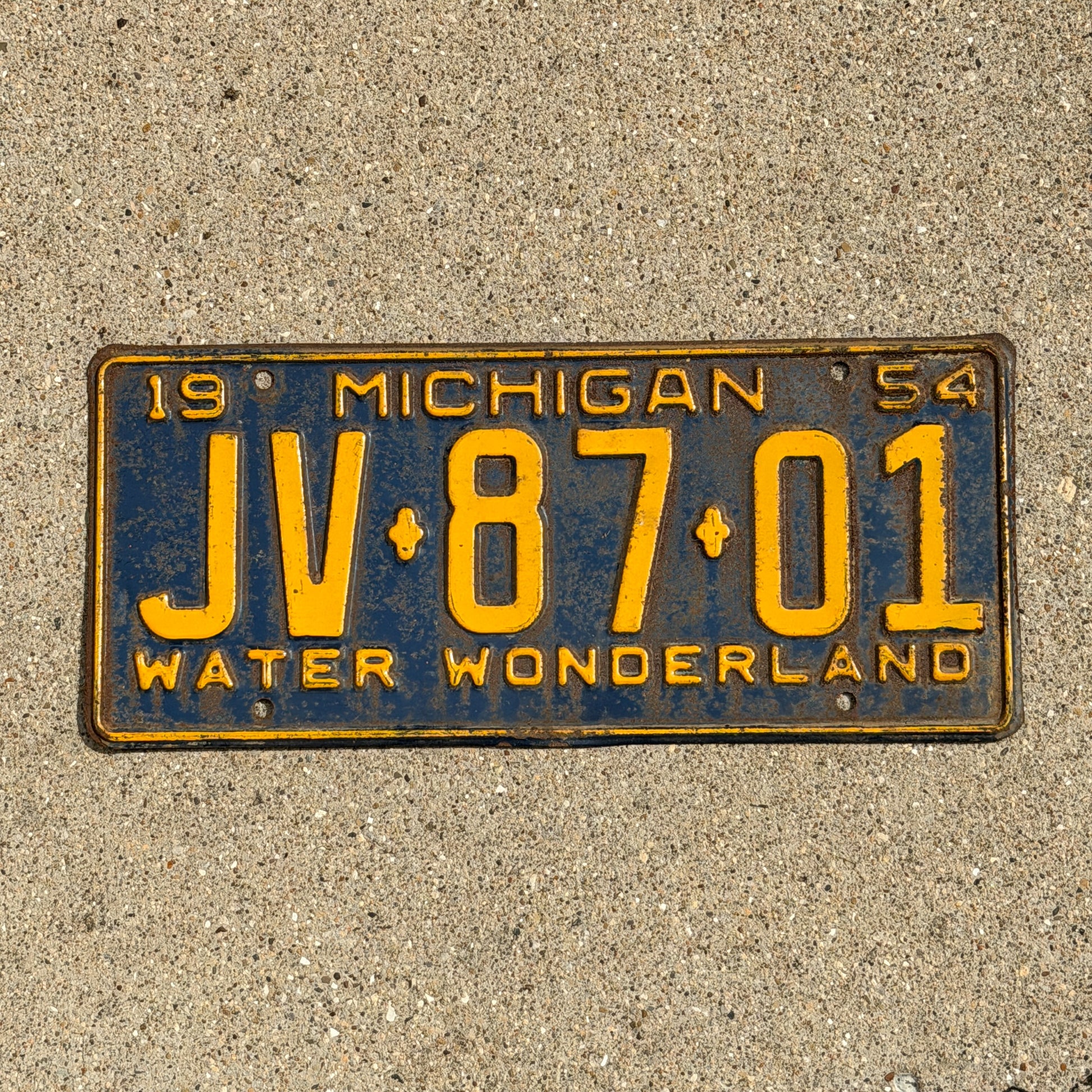 Photo of a 1954 Michigan License Plate Auto Tag Garage Decor Vintage JV 87 01 with original patina
