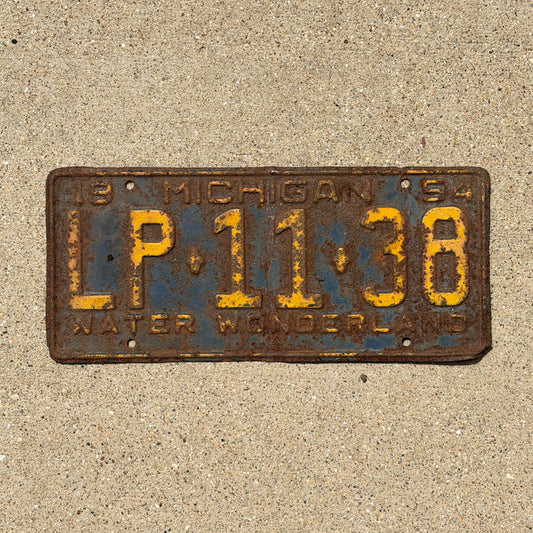 Photo of a 1954 Michigan License Plate Auto Tag Garage Decor Vintage LP 11 38 with original patina