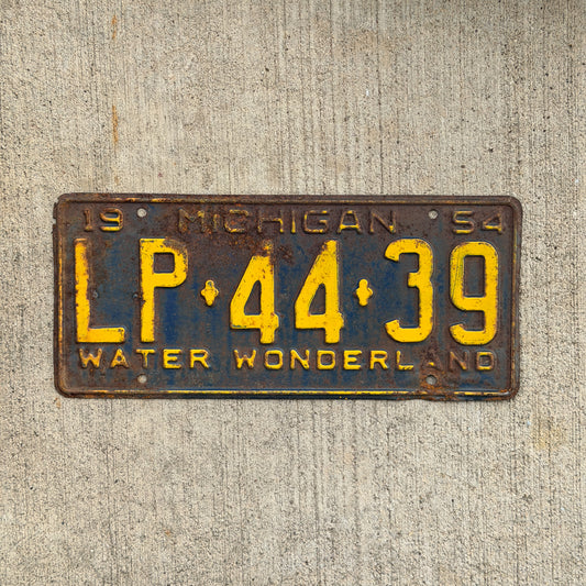 Photo of a 1954 Michigan License Plate Auto Tag Garage Decor Vintage LP 44 39 with original patina