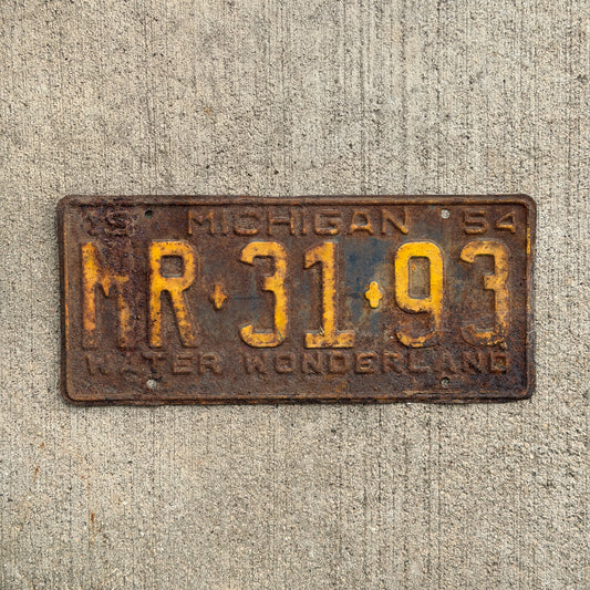 Photo of a 1954 Michigan License Plate Auto Tag Garage Decor Vintage MR 31 93 with original patina
