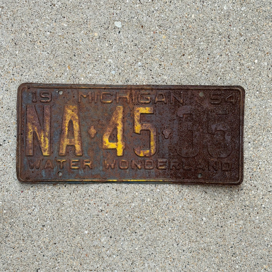 Photo of a 1954 Michigan License Plate Auto Tag Garage Decor Vintage NA 45 35 with original patina