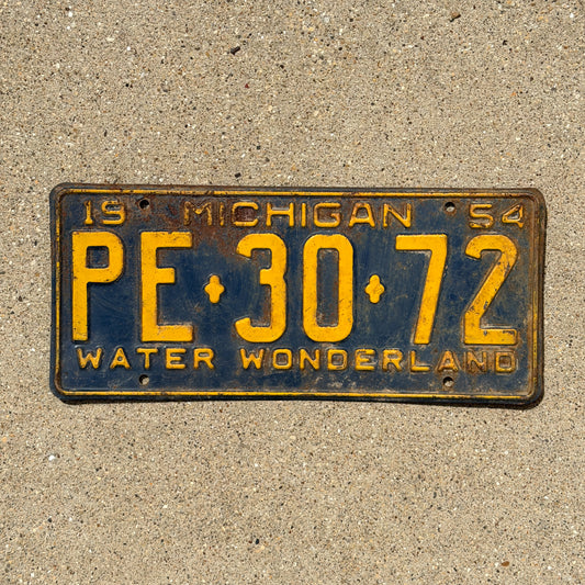 Photo of a 1954 Michigan License Plate Auto Tag Garage Decor Vintage PE 30 72 with original patina