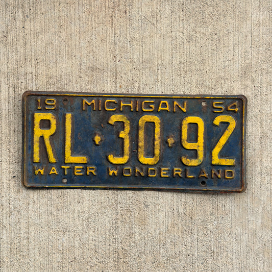 Photo of a 1954 Michigan License Plate Auto Tag Garage Decor Vintage RL 30 92 with original patina