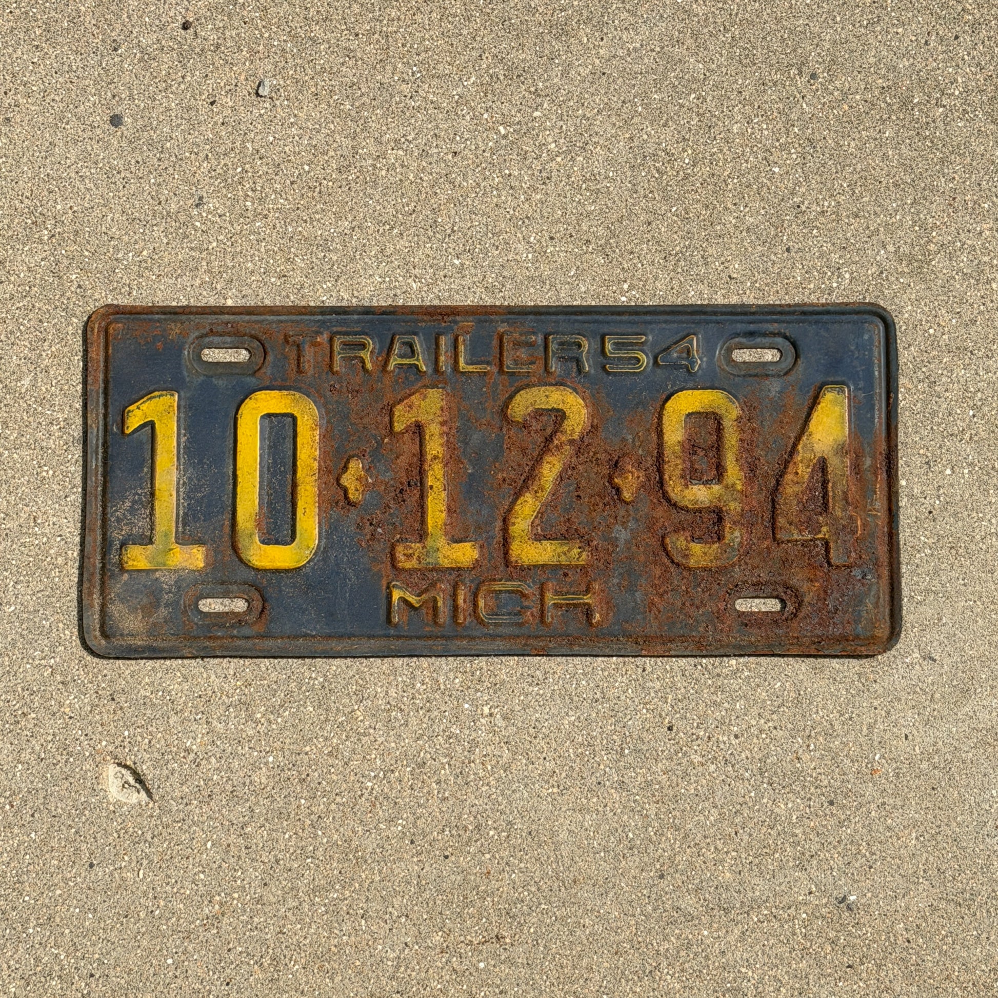 Photo of a 1954 Michigan Trailer License Plate Auto Tag Garage Decor Vintage 10 12 94 with original patina