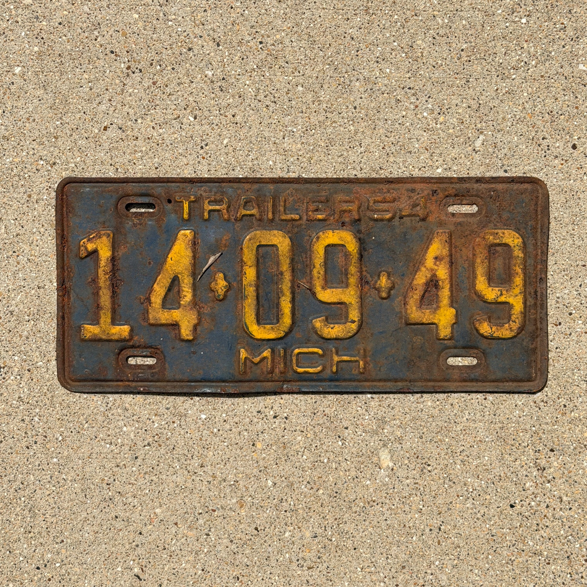 Photo of a 1954 Michigan Trailer License Plate Auto Tag Garage Decor Vintage 14 09 49 with original patina