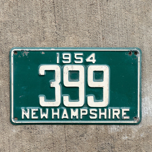 Photo of a 1954 New Hampshire License Plate Auto Tag Garage Decor Vintage Low Number Three Digit 399 with original patina