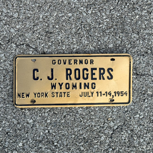 Photo of a 1954 New York Governor's Conference License Plate Booster License Plate Auto Tag Garage Decor Vintage Governors Conference Gov Rogers Wyoming with original patina