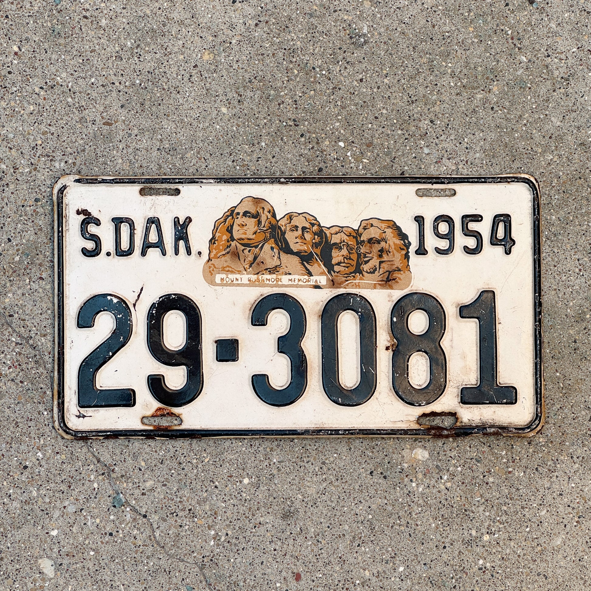Photo of a 1954 South Dakota License Plate Auto Tag Garage Decor Vintage Mount Rushmore 29 3081 with original patina