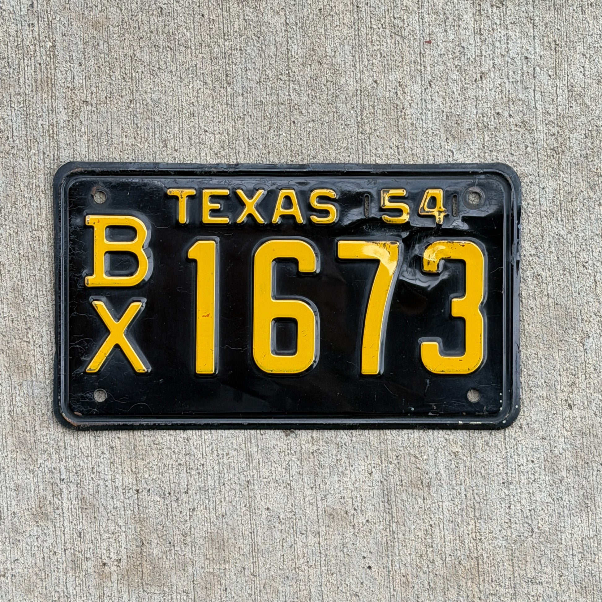 Photo of a 1954 Texas License Plate Auto Tag Garage Decor Vintage BX 1673 with original patina
