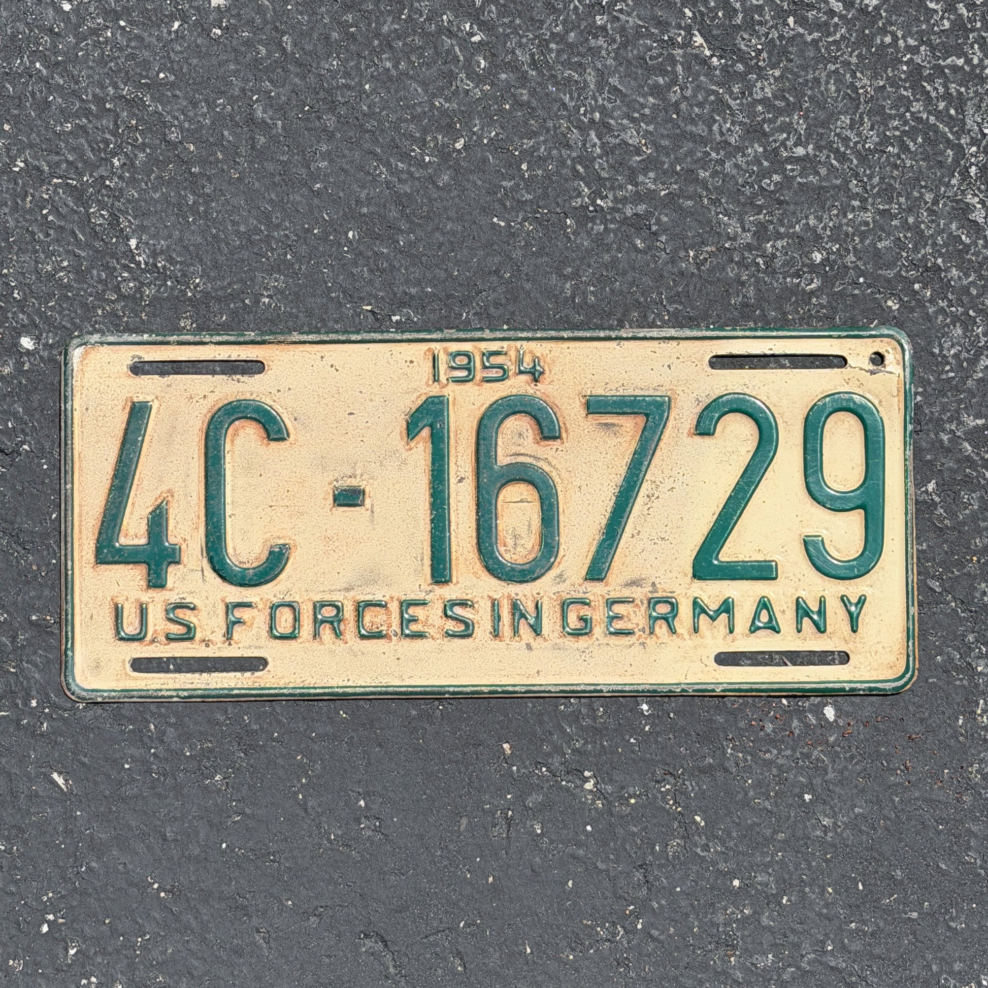 Photo of a 1954 US Forces Germany License Plate Auto Tag Garage Decor Vintage 4C 16729 with original patina