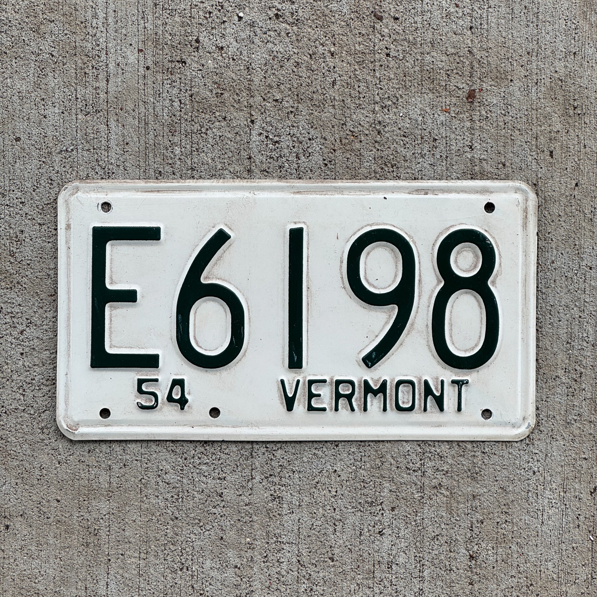 Photo of a 1954 Vermont License Plate Auto Tag Garage Decor Vintage E 6198 with original patina