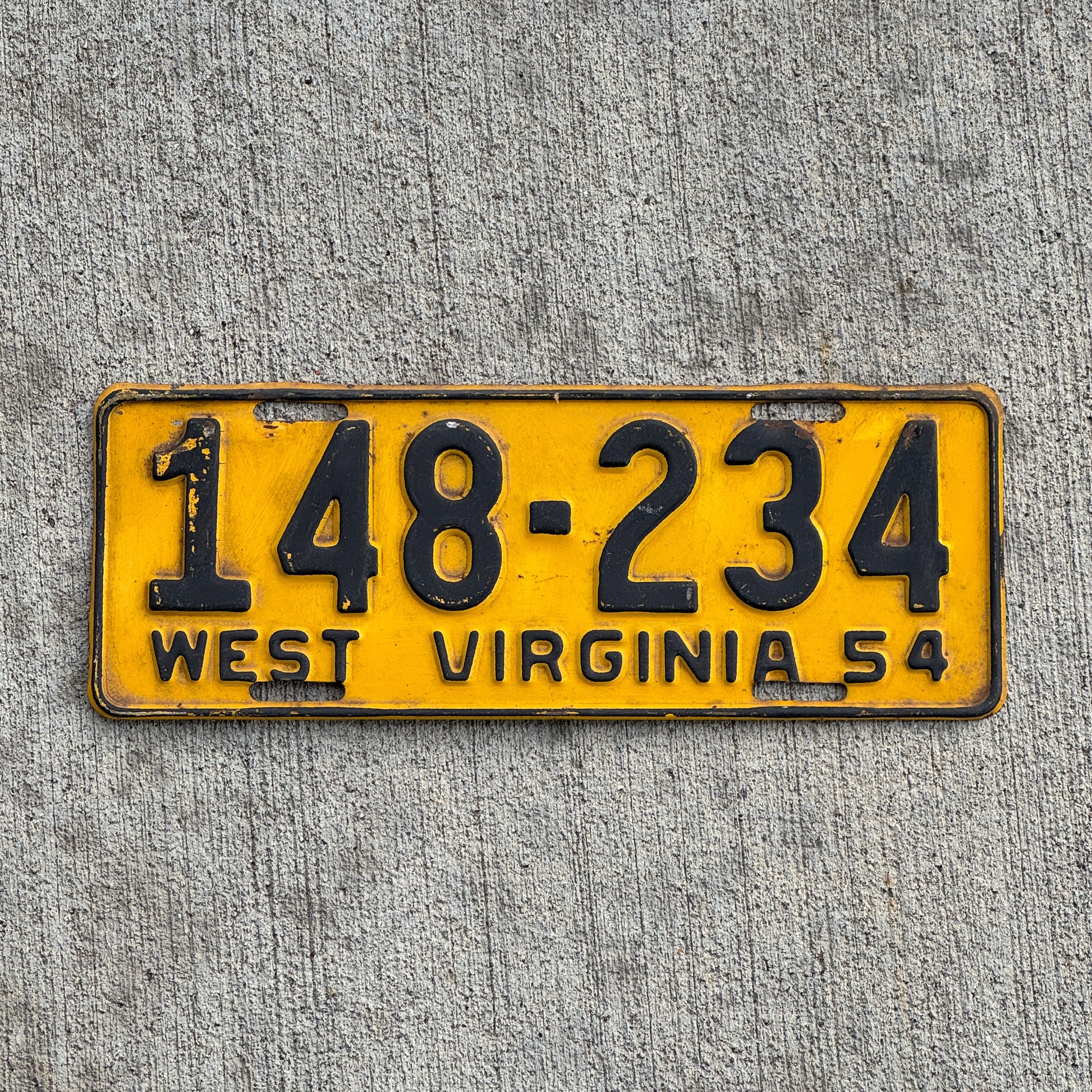 Photo of a 1954 West Virginia License Plate Auto Tag Garage Decor Vintage 148 234 with original patina