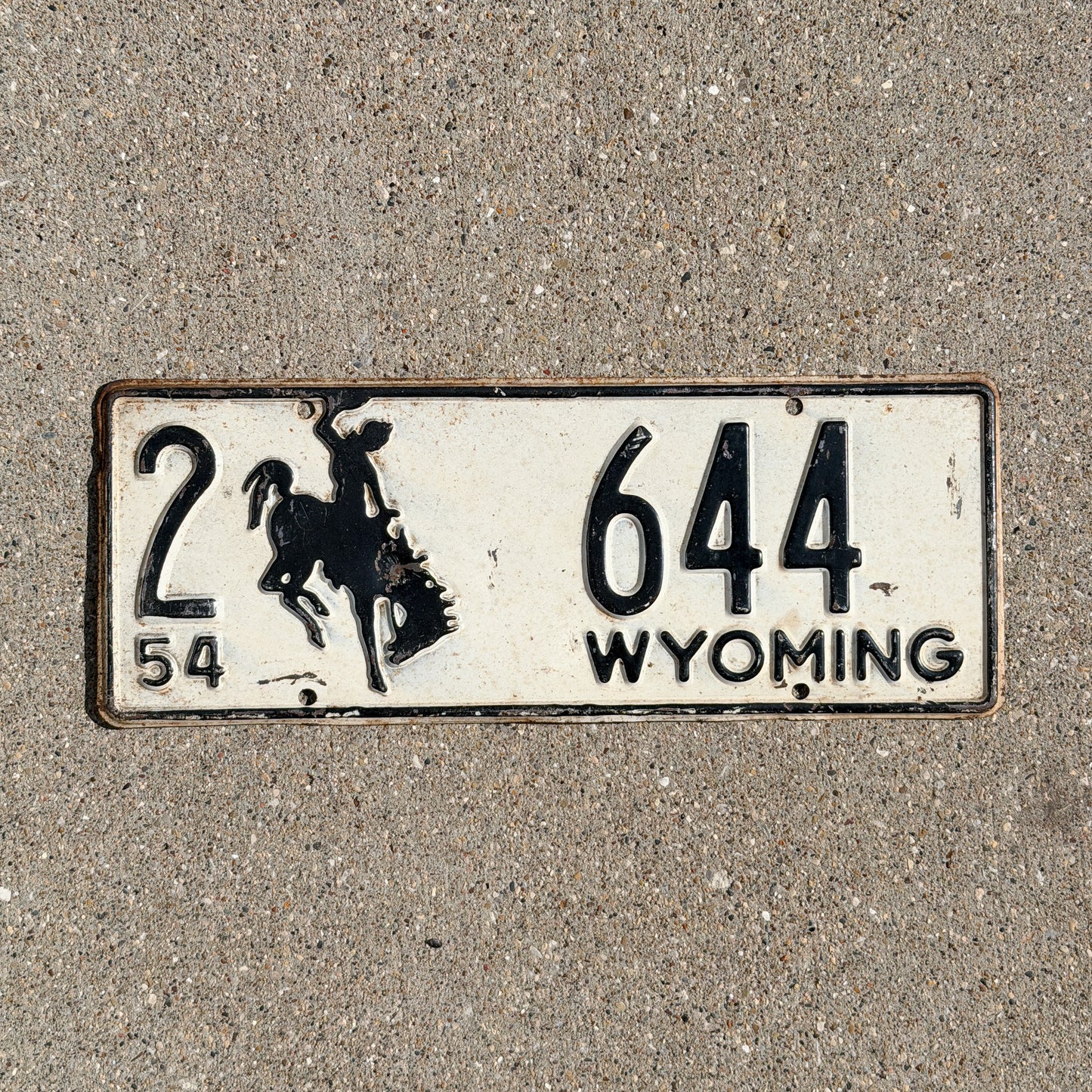 Photo of a 1954 Wyoming License Plate Auto Tag Garage Decor Vintage Cowboy Rodeo 2 644 with original patina