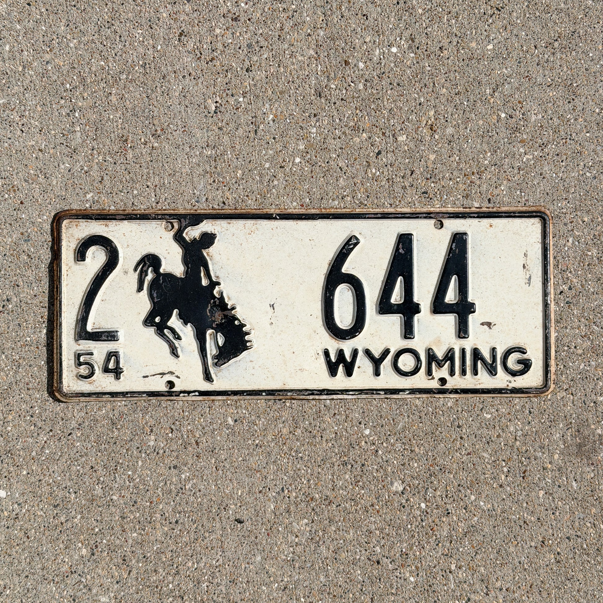 Photo of a 1954 Wyoming License Plate Auto Tag Garage Decor Vintage Cowboy Rodeo 2 644 with original patina