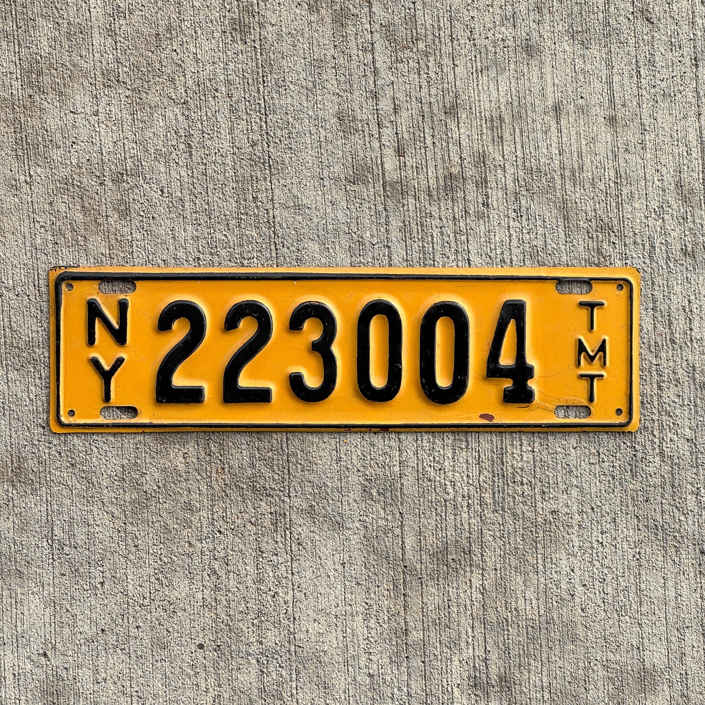 Photo of a 1955 1957 New York Truck Mile Tax License Plate Auto Tag Garage Decor Vintage Series 2 223004 with original patina