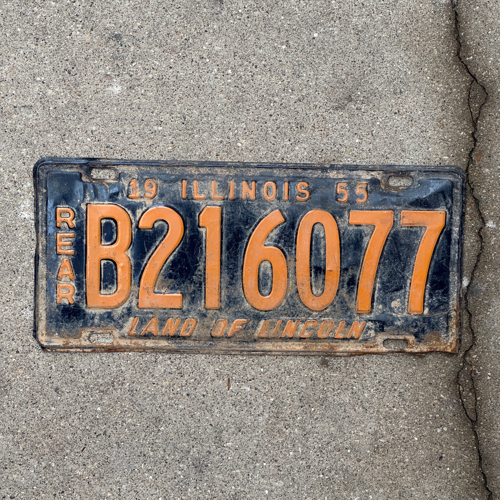 Photo of a 1955 Illinois Truck License Plate Auto Tag 1 Vintage Garage Rear Plate Orange Blue B 216 077 with original patina