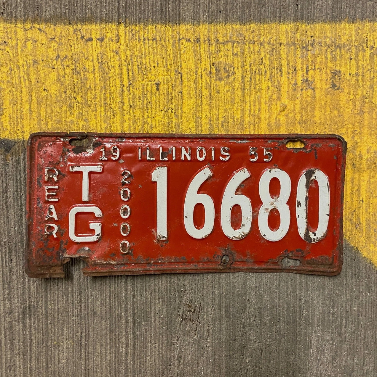 Photo of a 1955 Illinois Truck Mileage Tax License Plate Auto Tag Garage Decor Vintage Rear TG 16680 with original patina