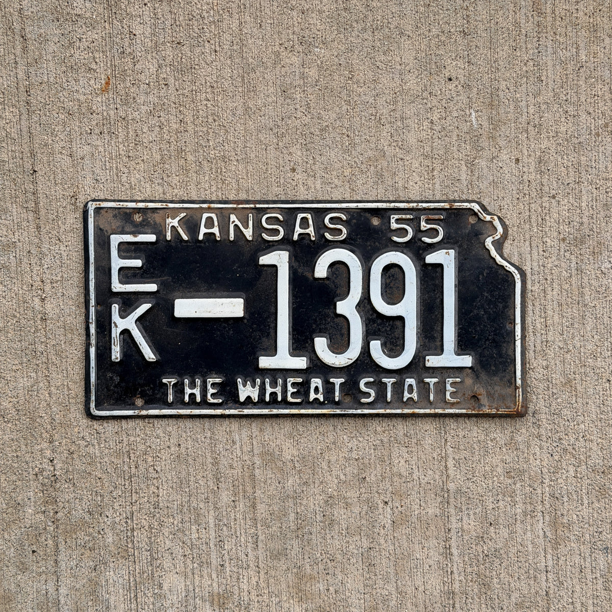 Photo of a 1955 Kansas License Plate Auto Tag Garage Decor Vintage State Shape EK 1391 with original patina