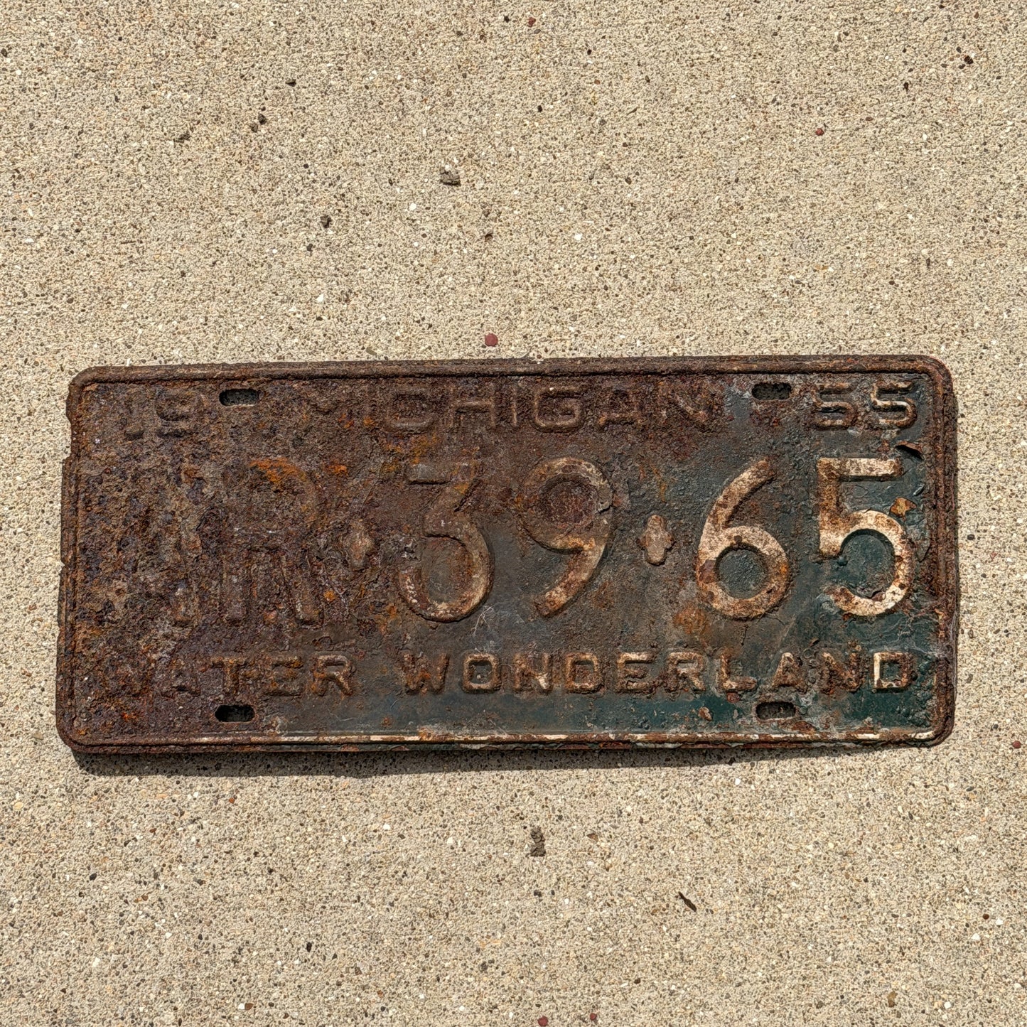 Photo of a 1955 Michigan License Plate Auto Tag Garage Decor Vintage AR 39 65 with original patina
