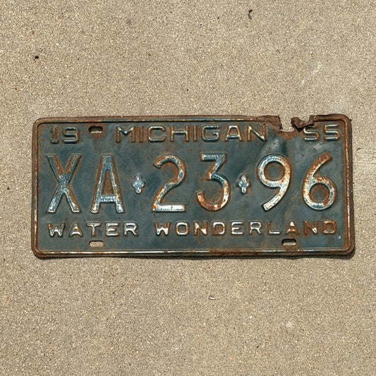 Photo of a 1955 Michigan License Plate Auto Tag Garage Decor Vintage XA 23 96 with original patina
