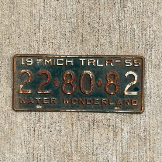 Photo of a 1955 Michigan Trailer License Plate Auto Tag Garage Decor Vintage 22 80 82 with original patina