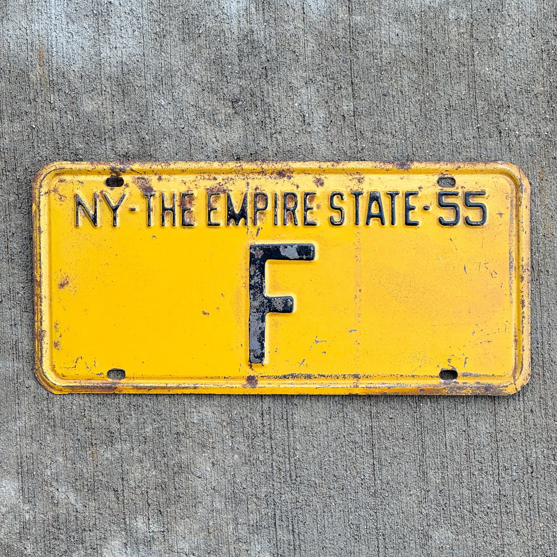 Photo of a 1955 New York Reserved License Plate Auto Tag Garage Decor Vintage Single Letter F with original patina