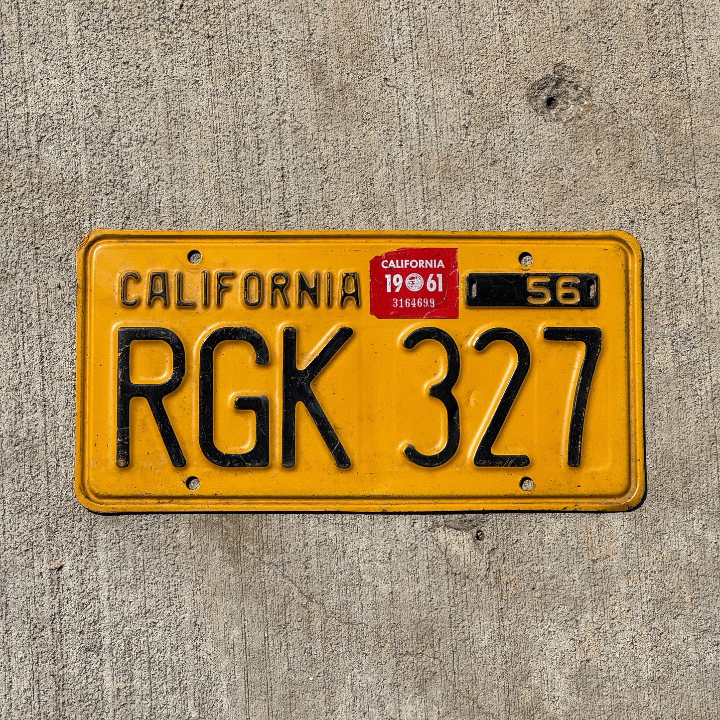 Photo of a 1956 1961 California License Plate Auto Tag Garage Decor Vintage RGK 327 with original patina
