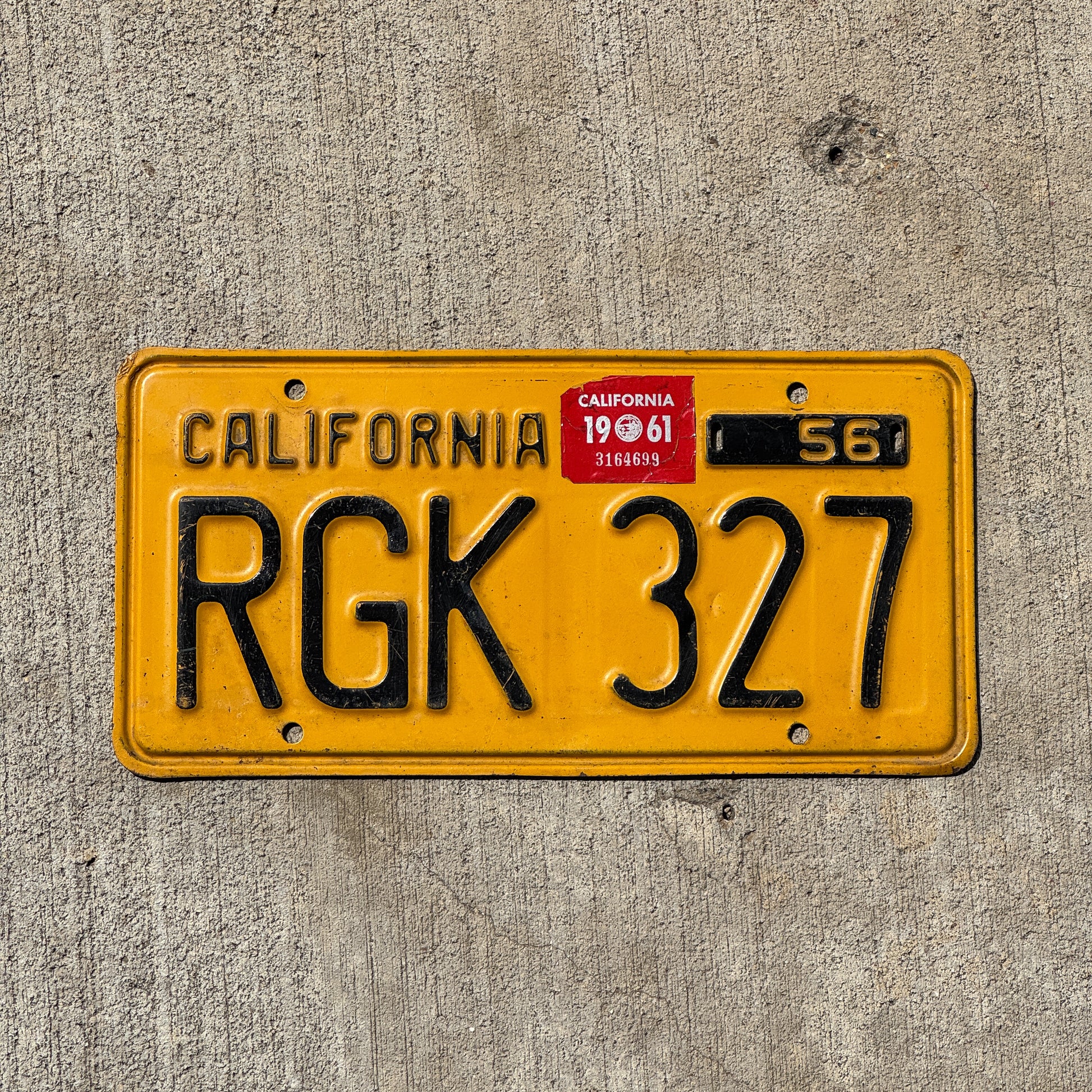 Photo of a 1956 1961 California License Plate Auto Tag Garage Decor Vintage RGK 327 with original patina