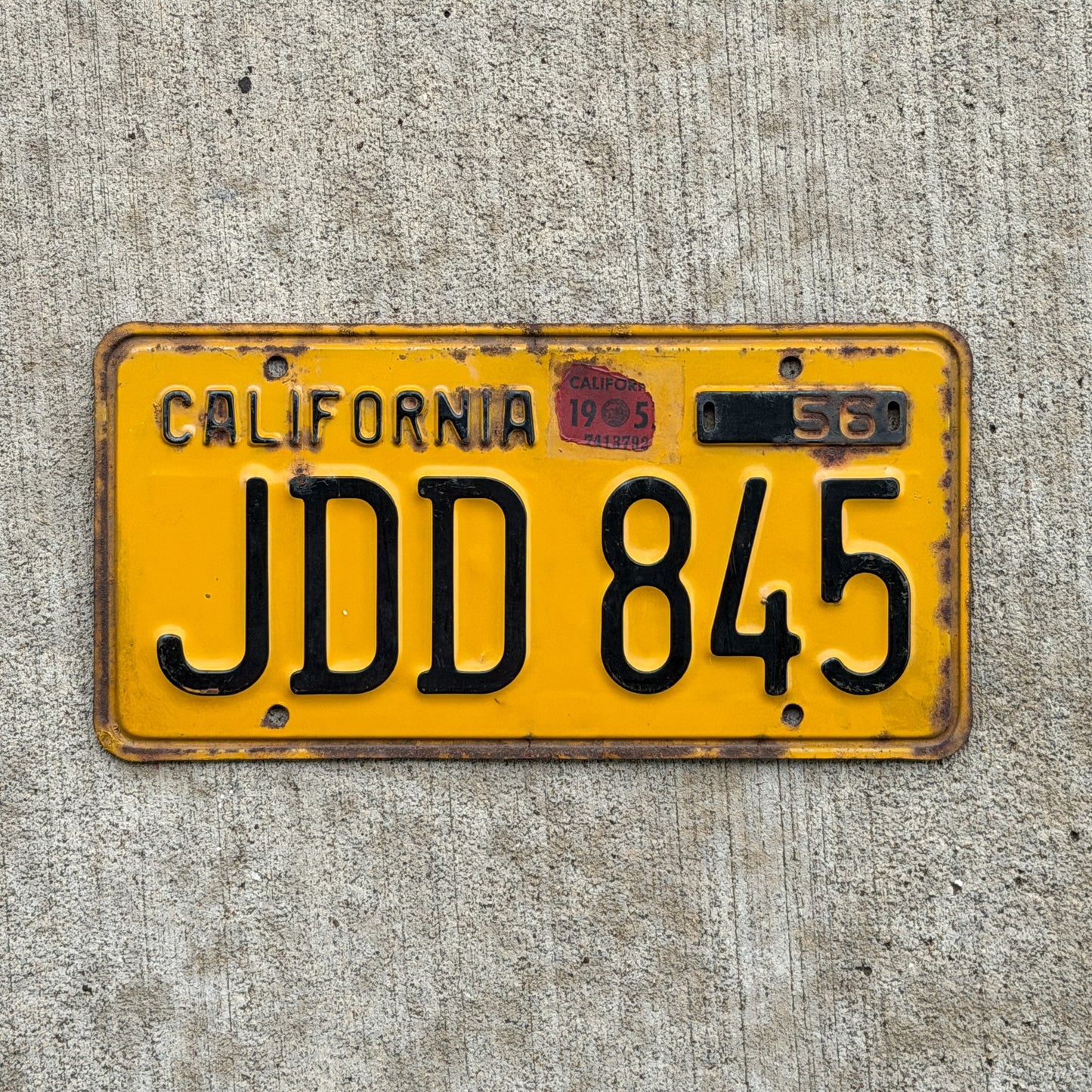 Photo of a 1956 California License Plate Auto Tag Garage Decor Vintage JDD 845 with original patina