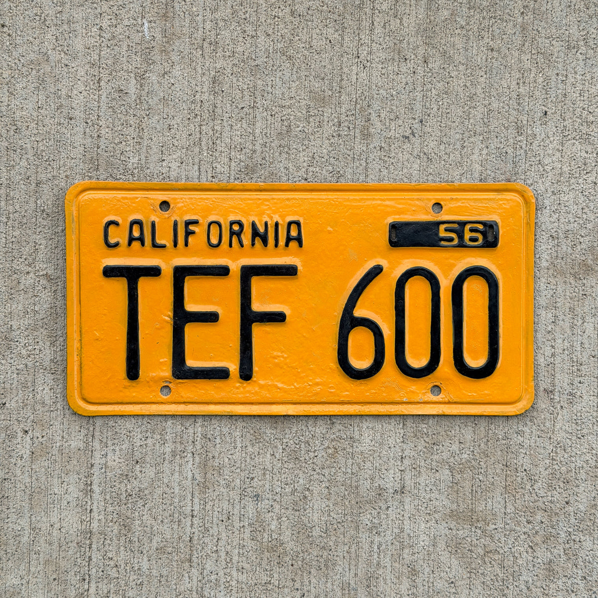 Photo of a 1956 California License Plate Auto Tag Garage Decor Vintage TEF 600 with original patina