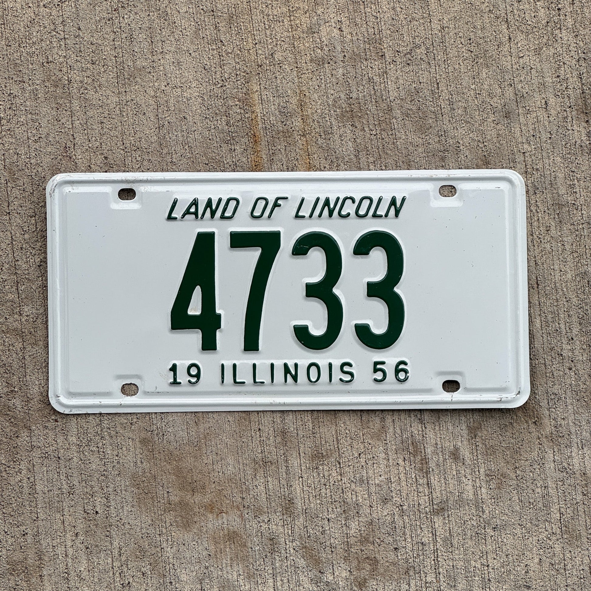 Photo of a 1956 Illinois License Plate Auto Tag Garage Decor Vintage Low Number Four Digit 4733 with original patina