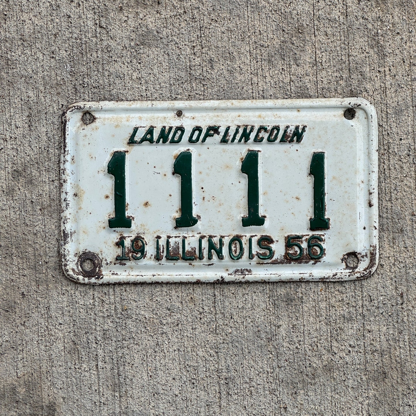 Photo of a 1956 Illinois Motorcycle License Plate Auto Tag Garage Decor Vintage Repeat Repeating 1111 with original patina