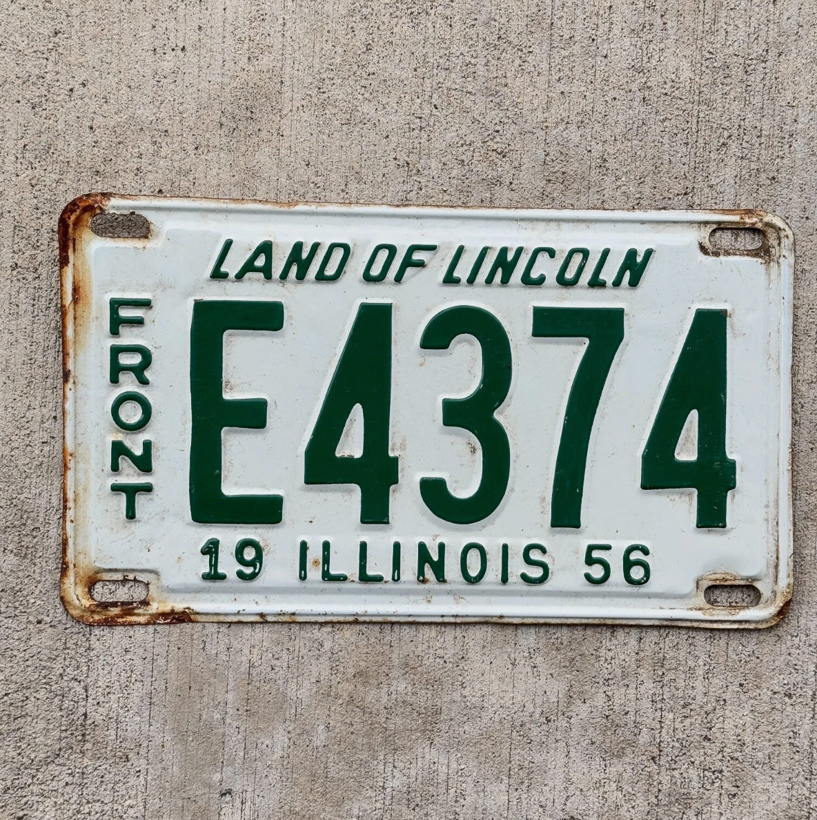 Photo of a 1956 Illinois Truck License Plate Auto Tag Garage Decor Shorty Front E 4374